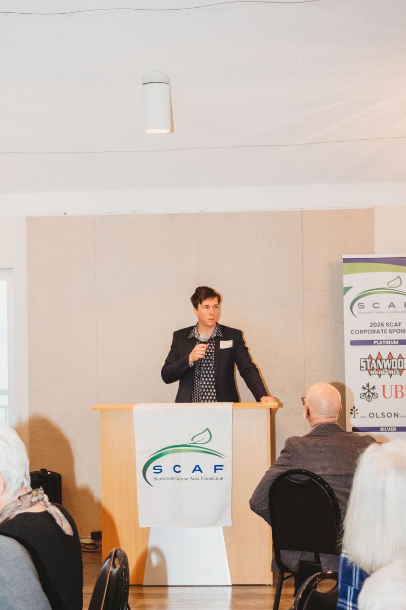 Andrew Davis speaks at the podium